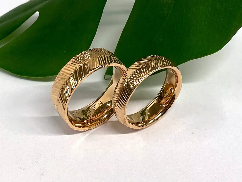 Pair of handmade textured gold wedding bands