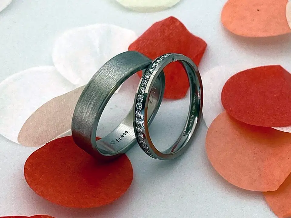 Platinum wedding bands: a matte ring and a pavé diamond ring