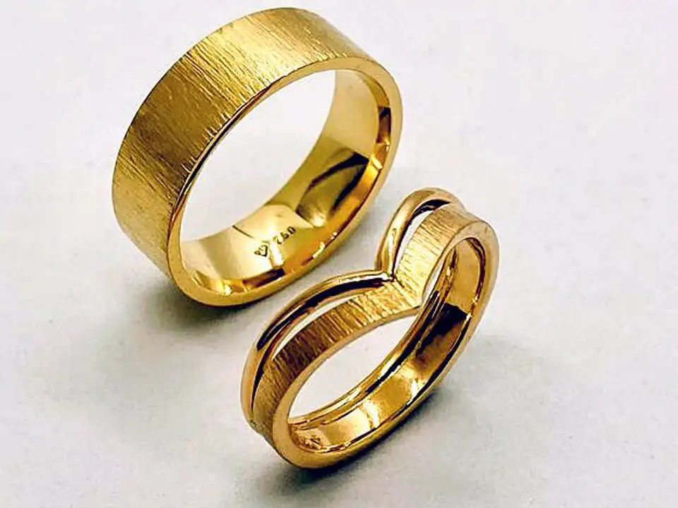Handmade gold rings, one with a double band